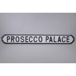 A painted wood sign, Prosecco Palace', the style of a road sign, 105cm long x 14cm high