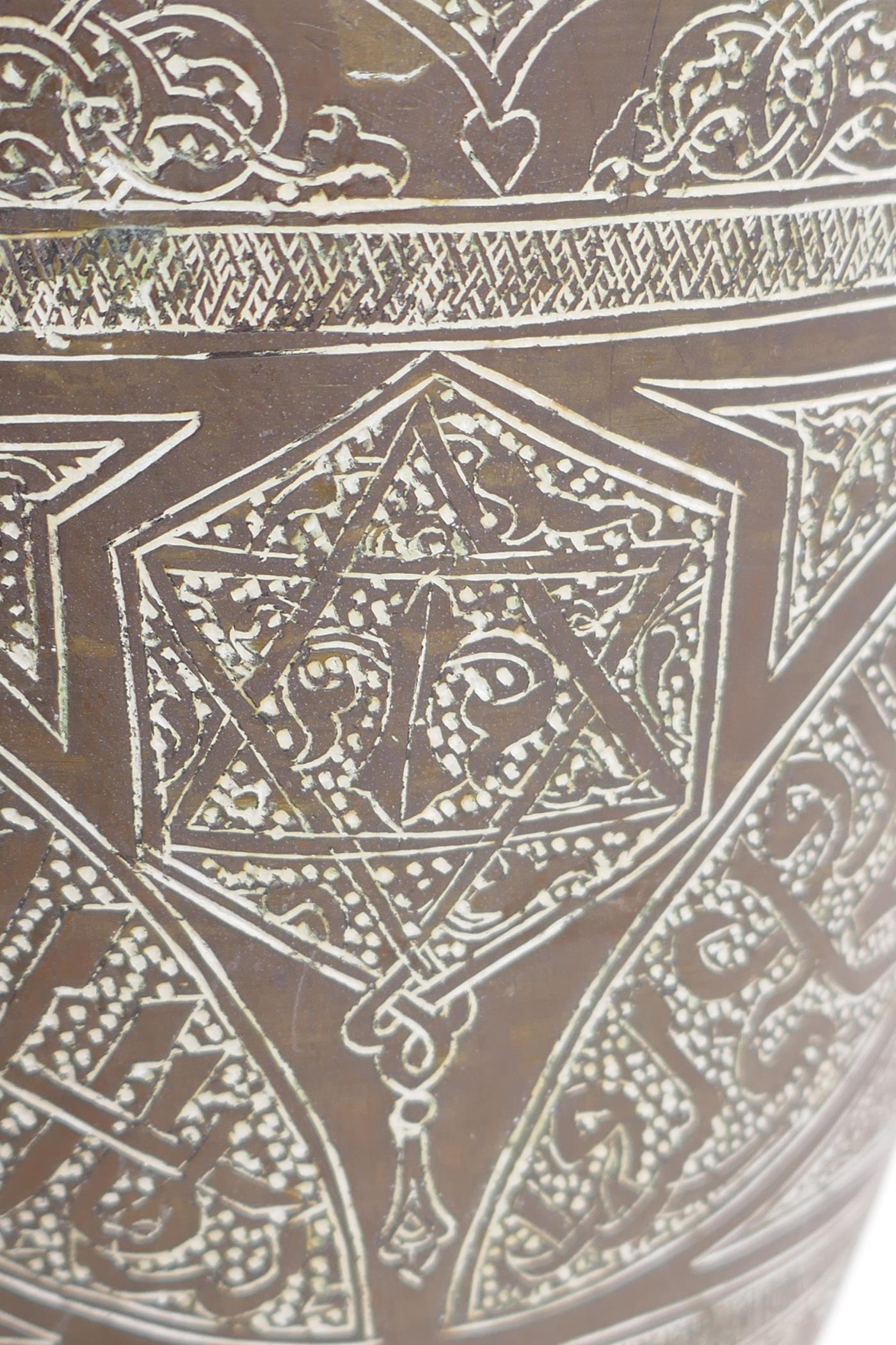 An Islamic brass vase with chased script decoration, converted to a table lamp, 67cm high - Image 5 of 6