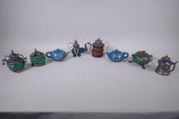 Eight Chinese white metal mounted hardstone and composition teapots/censers decorated with