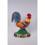 A painted cast iron cockerel door stop, 34cm high