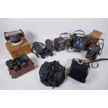 Three vintage medium format film cameras including two Voigtlander Brilliant Compur and Lubitel 2, a