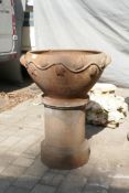 A terracotta urn on stand, 60cm diameter, 79cm high