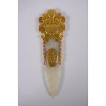 A Chinese archaic style jade carving of a blade, with gilt highlights, 18cm