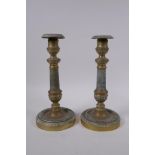 A pair of brass candlesticks with machined decoration, 25cm high