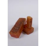 A Chinese amber soapstone box containing an amber soapstone seal, the cover with carved decoration