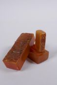 A Chinese amber soapstone box containing an amber soapstone seal, the cover with carved decoration