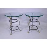 A pair of Maison Jansen style wrought steel occasional tables with brass mounts, goat's mask