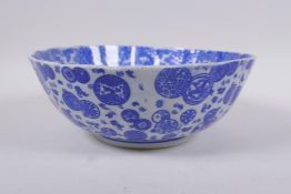 A Chinese blue and white porcelain bowl of petal form, decorated with dragons and auspicious