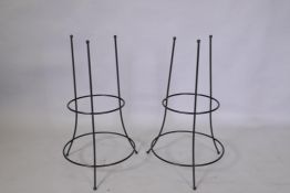 A pair of wrought metal plant supports, 73cm high