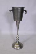 A cast metal Champagne bucket on stand, 74cm high