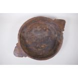 An antique Indian carved wood bowl/chapati dish, 38cm diameter