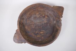 An antique Indian carved wood bowl/chapati dish, 38cm diameter