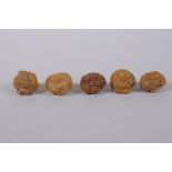 Five Japanese carved tagua nut netsuke in the form of various animals, 3cm diameter