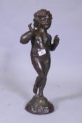 A cast iron figure of a putto, 53cm high