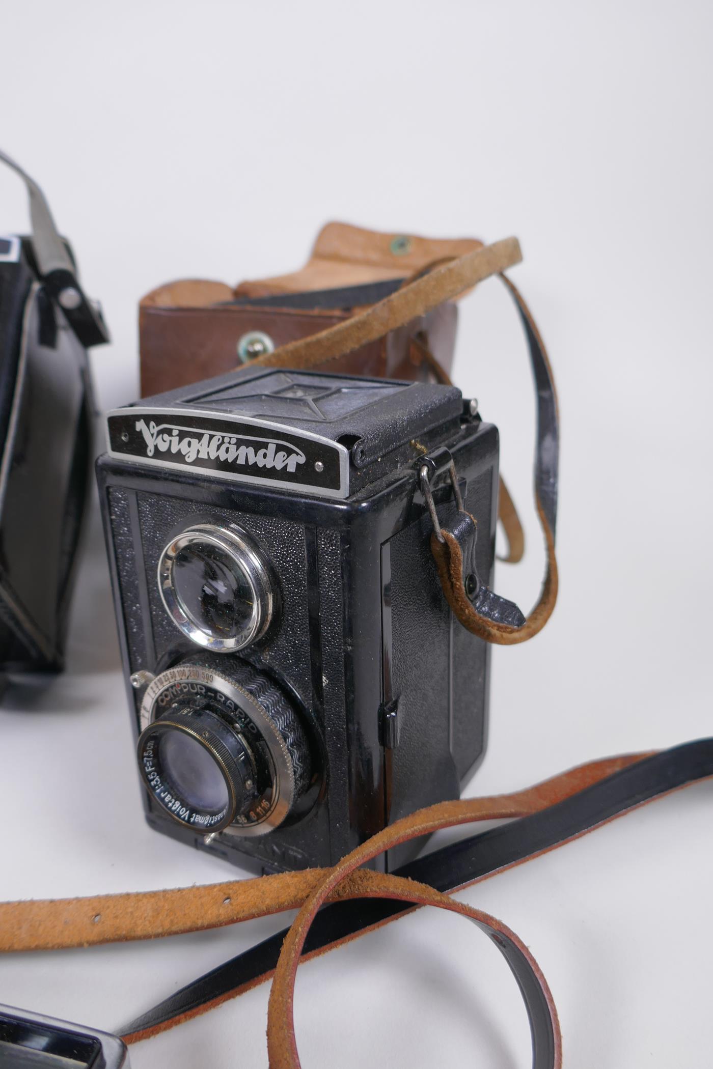 Three vintage medium format film cameras including two Voigtlander Brilliant Compur and Lubitel 2, a - Image 2 of 9