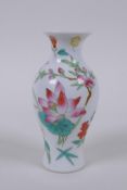 A Chinese polychrome porcelain stem vase with floral decoration, 4 character mark to base, 11cm high