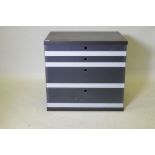 A black ash chest with four graduated glass front drawers, 72 x 54 x 67cm