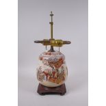 A Japanese Satsuma pottery jar and cover, decorated with an emperor and attendants, converted to a