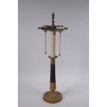 An Empire style bronze and ormolu two branch column table lamp, 52cm high