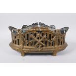 An antique empire style gilt metal planter decorated with torcheres, arrow quivers and floral swags,