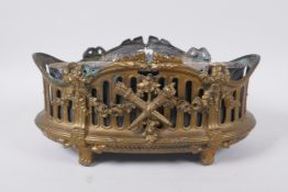 An antique empire style gilt metal planter decorated with torcheres, arrow quivers and floral swags,