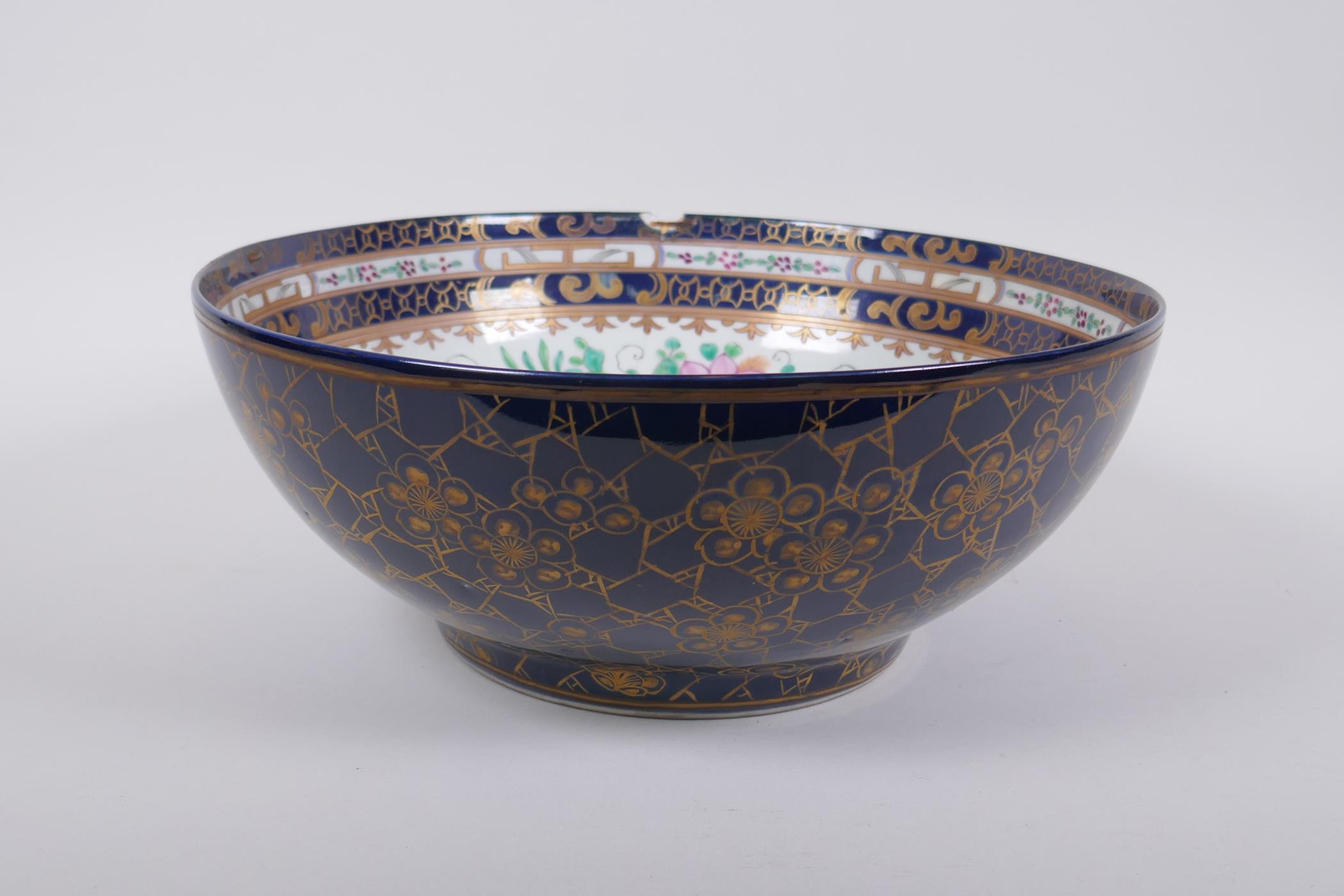 A late C19th/early C20th Chinese export ware punch bowl, the interior decorated with famille rose
