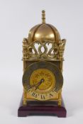 A brass cased lantern clock, 32cm high
