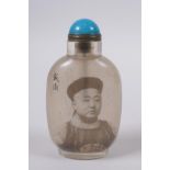 A Chinese reverse decorated glass snuff bottle with a portrait of an emperor, character