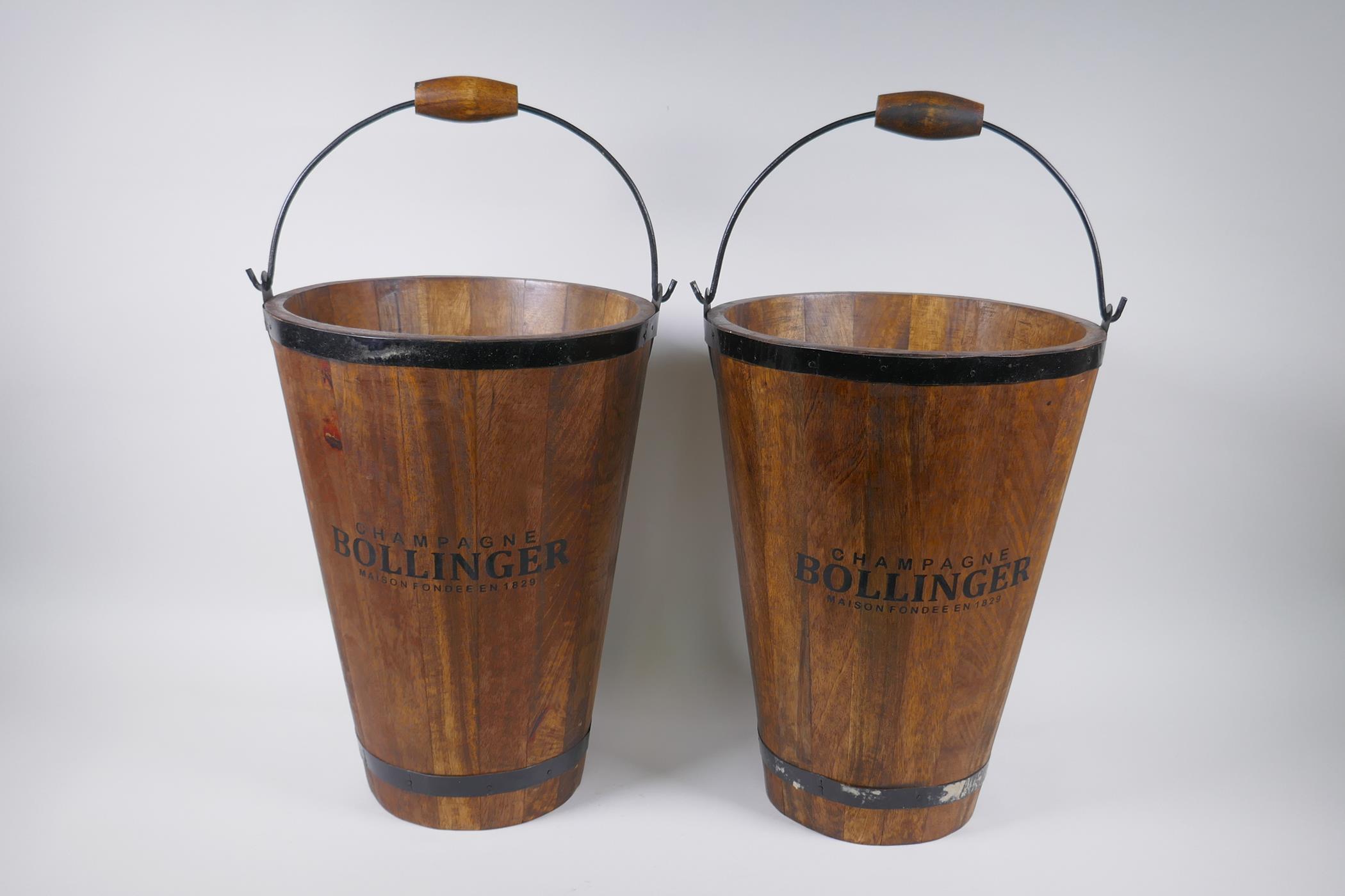 A pair of coopered wooden champagne buckets with Bollinger decoration, 40cm high, 30cm diameter