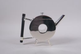 A Christopher Dresser style silver plated doughnut shaped teapot, 14cm high