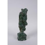 A Chinese green hardstone figure of an immortal, 19cm high