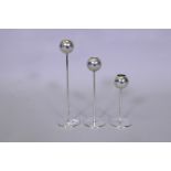 A set of three graduated chrome metal WMF candle holders, tallest 25cm high