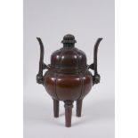 A Chinese bronze censer and cover of gourd form with two handles and tripod supports, 4 character