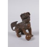 A Chinese bronze figure of a fo-dog, 6cm high