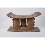 An African Ashanti carved wood headrest/stool, first half of the C20th, repairs, 44 x 16cm, 24cm