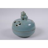 A Chinese Ru ware style porcelain censer and pierced cover, the cover with Fo dog knop, 13cm