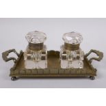 An antique brass and glass twin inkwell desk stand, 21 x 9cm