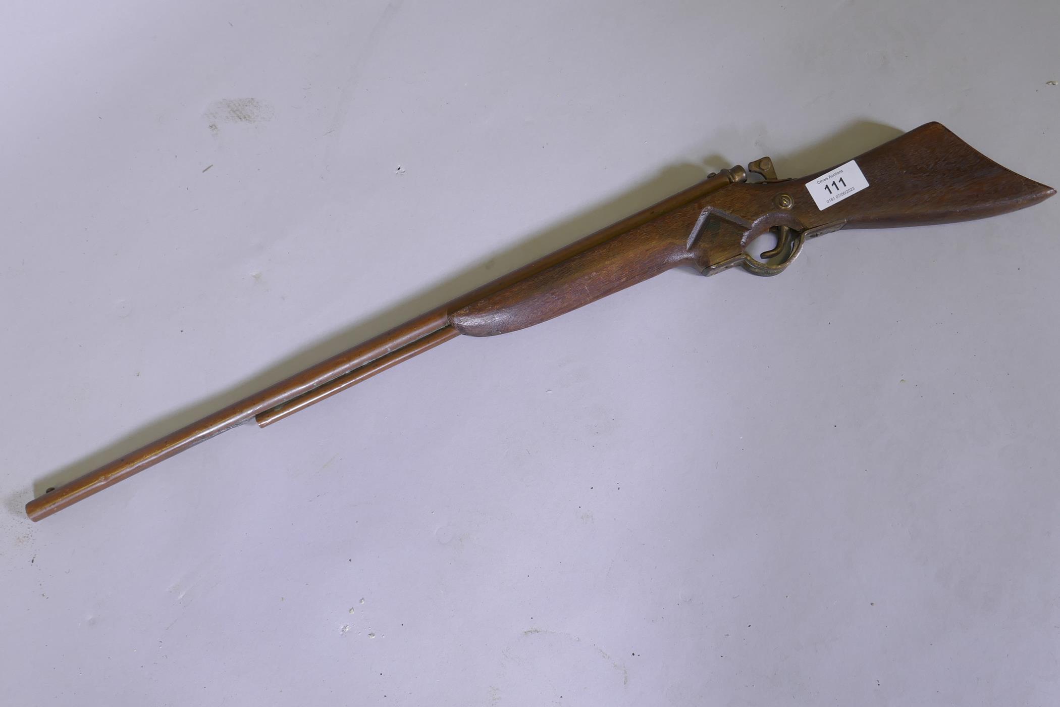 A child's toy rifle, 74cm long