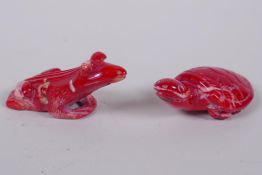 An oriental carved coral toad, and another4 carved in the form of a tortoise, 6cm long