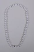 A white hardstone bead necklace, 68cm long