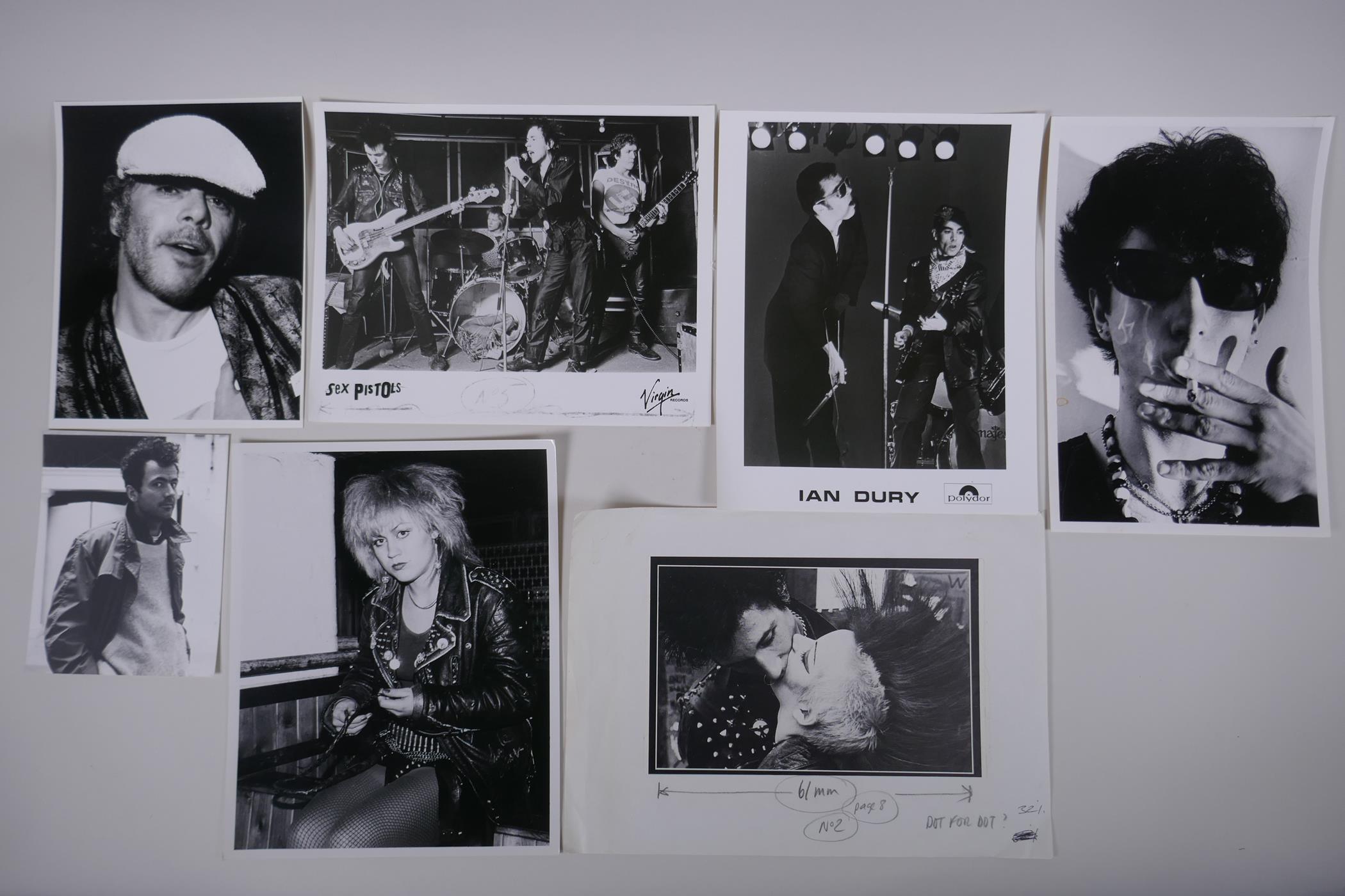 A collection of black and white press photographs of punk bands/musicians including Hugh Cornwell,