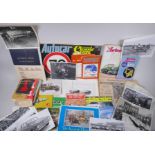 A collection of vintage motoring ephemera to include official car press photographs, automotive
