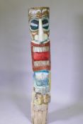 A carved and painted wood totem pole, 155cm high