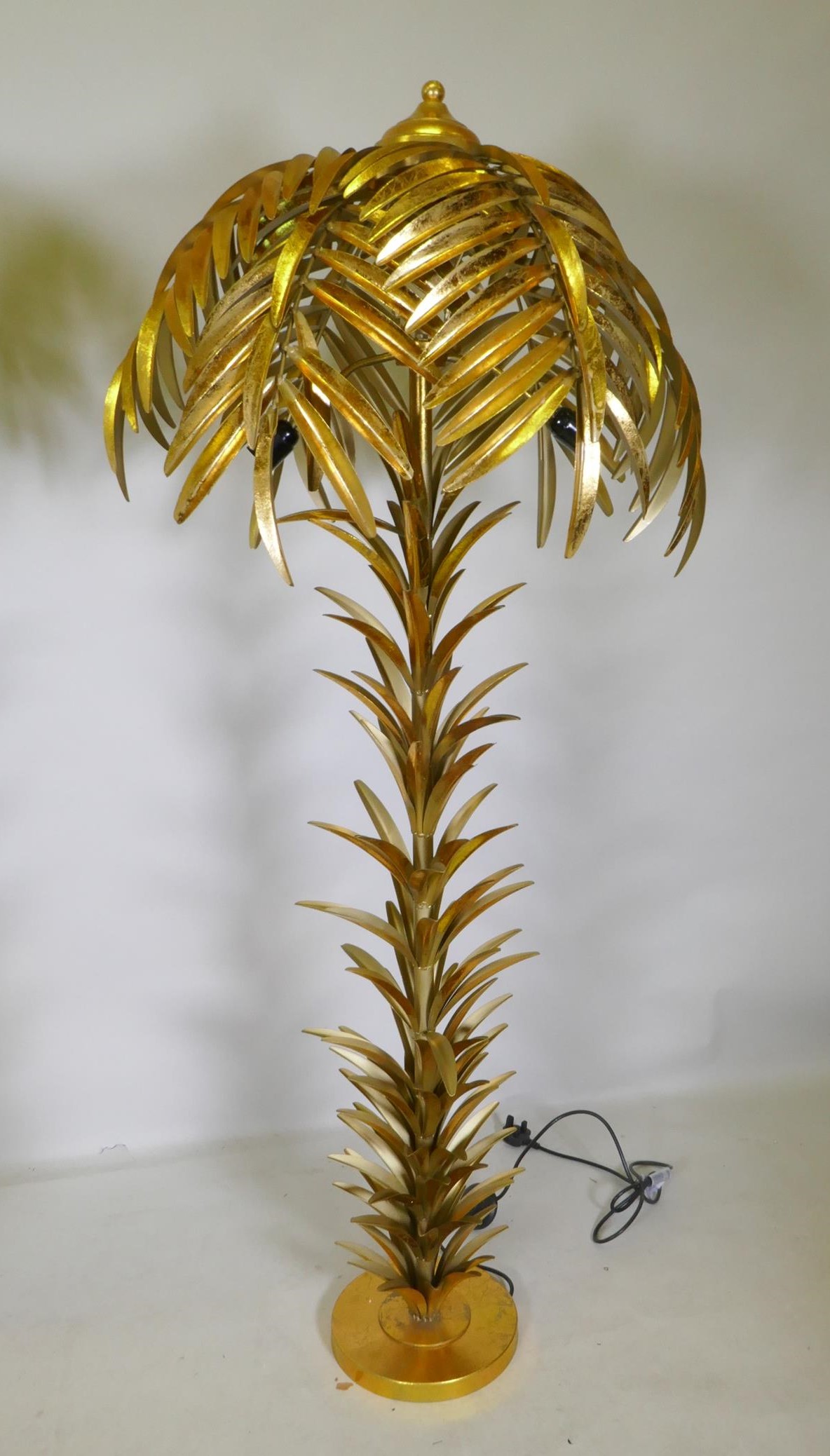 A gilt metal floor lamp in the form of a palm tree, 160cm high