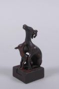 A Chinese miniature bronze twin deer seal with the remnants of gilt patina, 5cm high