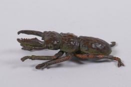 A Japanese style bronze okimono stag beetle, 6cm