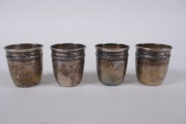 A set of four antique French silver shot beakers, 4cm high, 32g