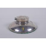 A hallmarked silver inkwell, Birmingham 1912, (weighted), 10cm diameter