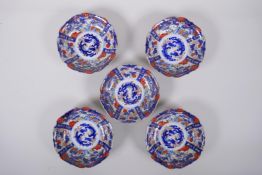 A set of five Japanese Imari porcelain bowls of lobed form, 14cm diameter