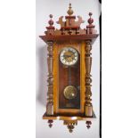A mahogany cased Vienna wall clock, the movement striking on a gong, 37 x 96cm